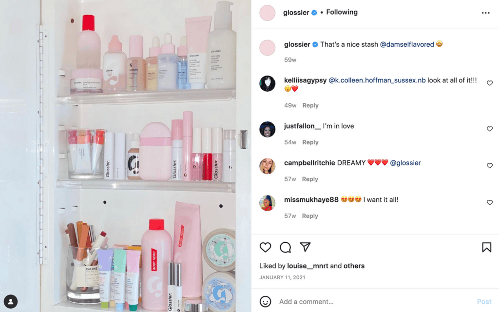 A neatly organized shelf filled with various Glossier products, shared by a user on Instagram. This user-generated content showcases the extensive range of Glossier's skincare and makeup items, highlighting the brand's ability to engage customers through organic marketing strategies.